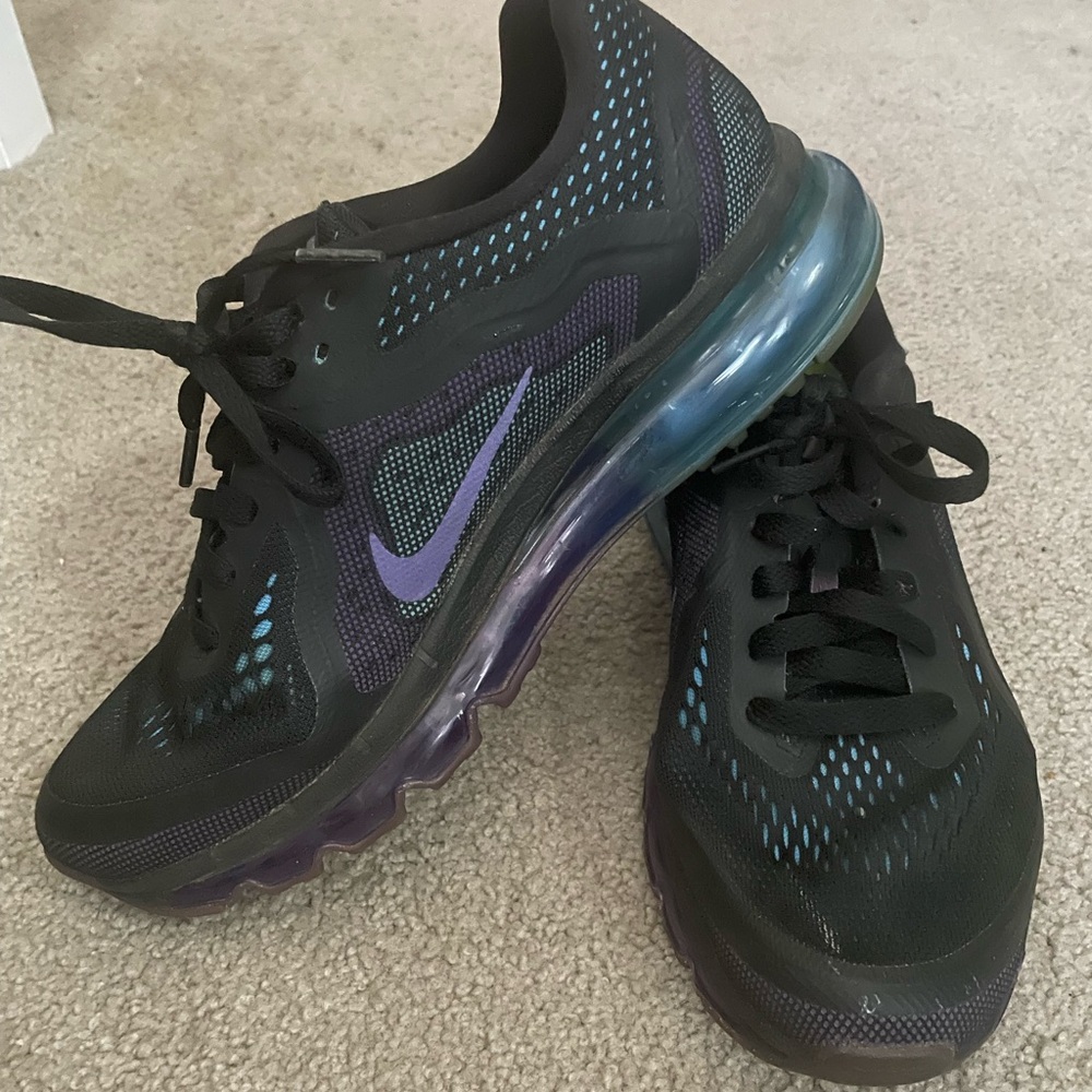 Black Nike sneakers with blue and purple accents